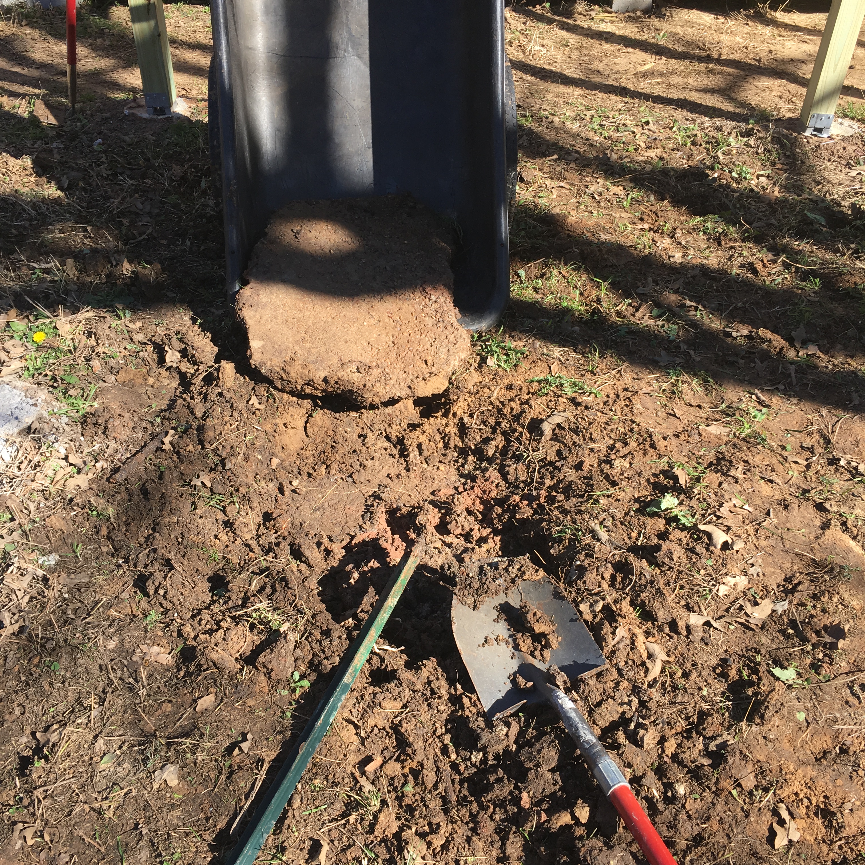 wheelbarrow with large lump of concrete